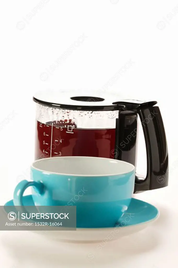 Coffee in glass coffee pot, blue cup 