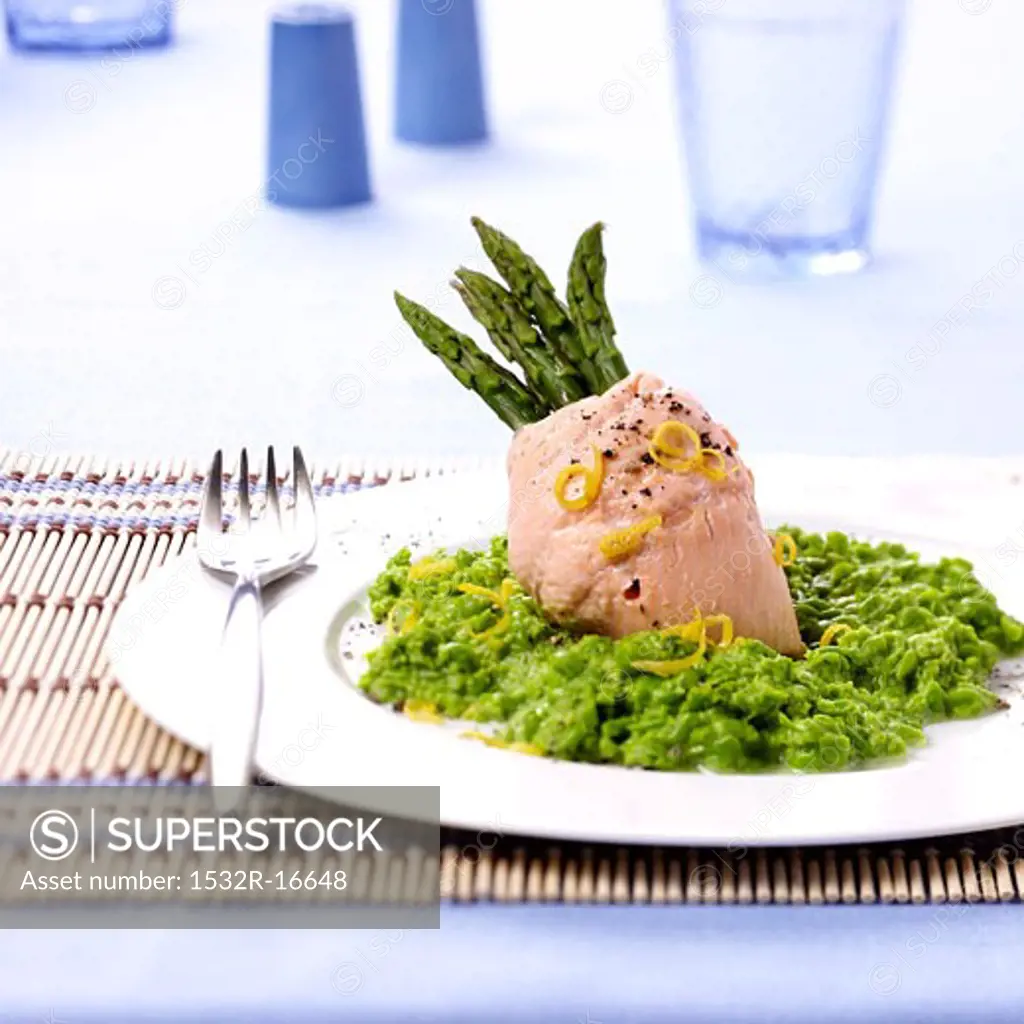 Steamed salmon trout with green asparagus and pea puree