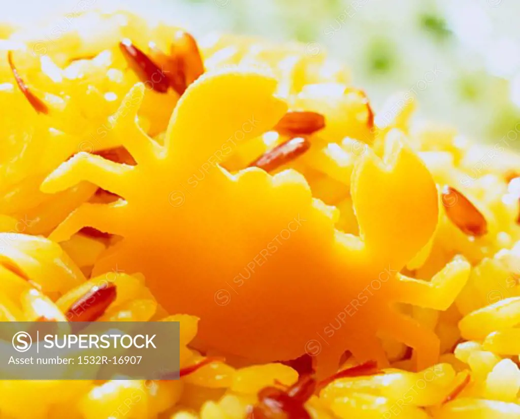 Carrot crab in saffron rice with red rice grains