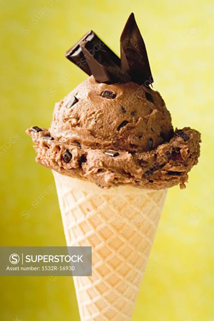 Chocolate ice cream with pieces of chocolate in cone