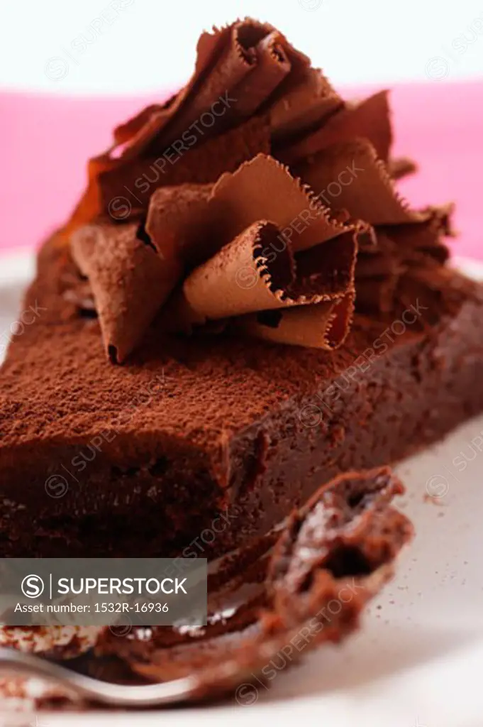 Piece of chocolate cake with chocolate curls