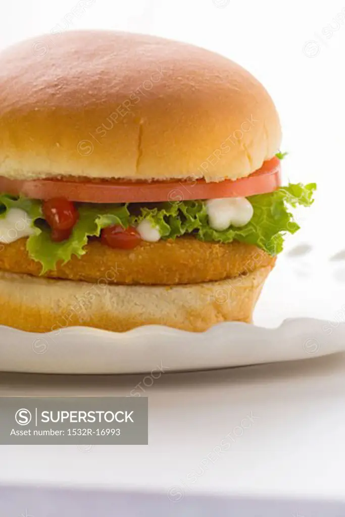 Chicken burger with tomato, lettuce, mayonnaise & ketchup