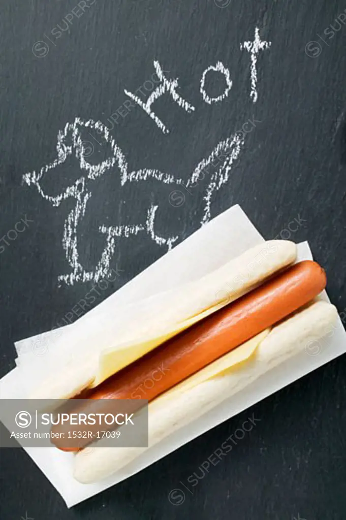 A hot dog on a blackboard (with drawing)