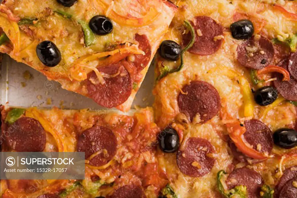 Salami pizza with peppers and olives