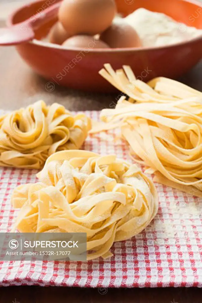 Three ribbon pasta nests