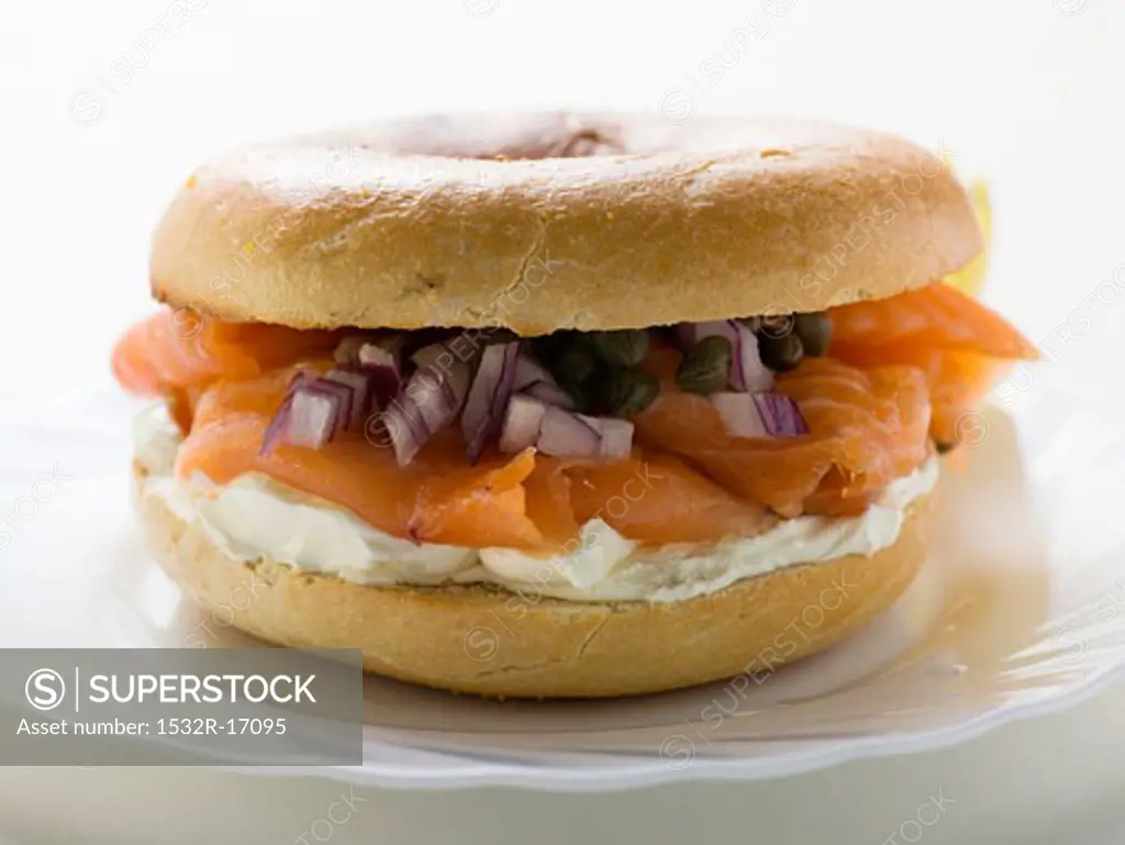 Salmon, cream cheese, onions and capers in a bagel