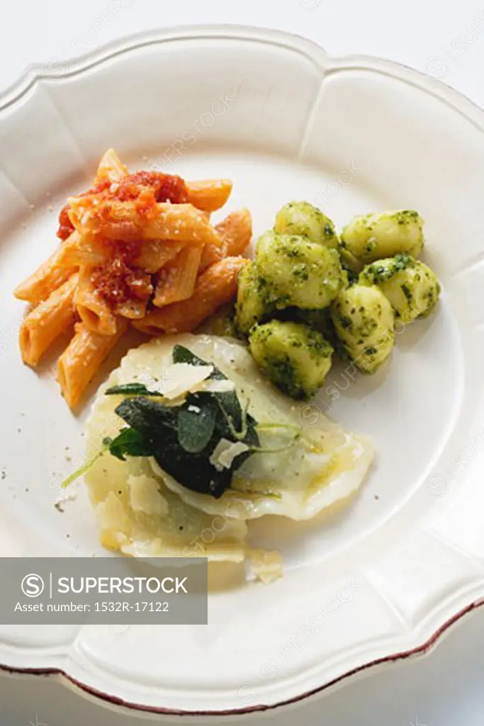 Three pasta dishes on one plate