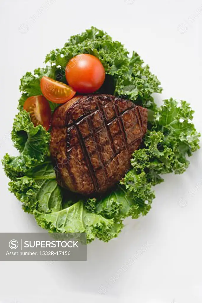 Grilled fillet steak on lettuce leaf
