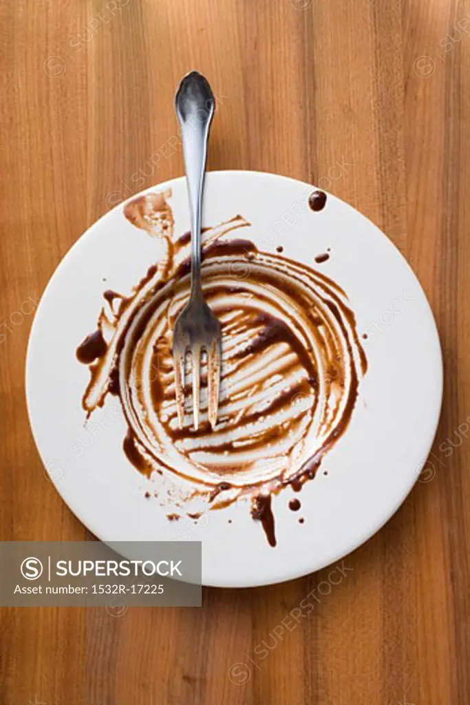 Plate with remains of chocolate sauce