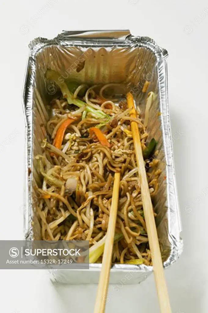 Remains of fried noodles in aluminium container
