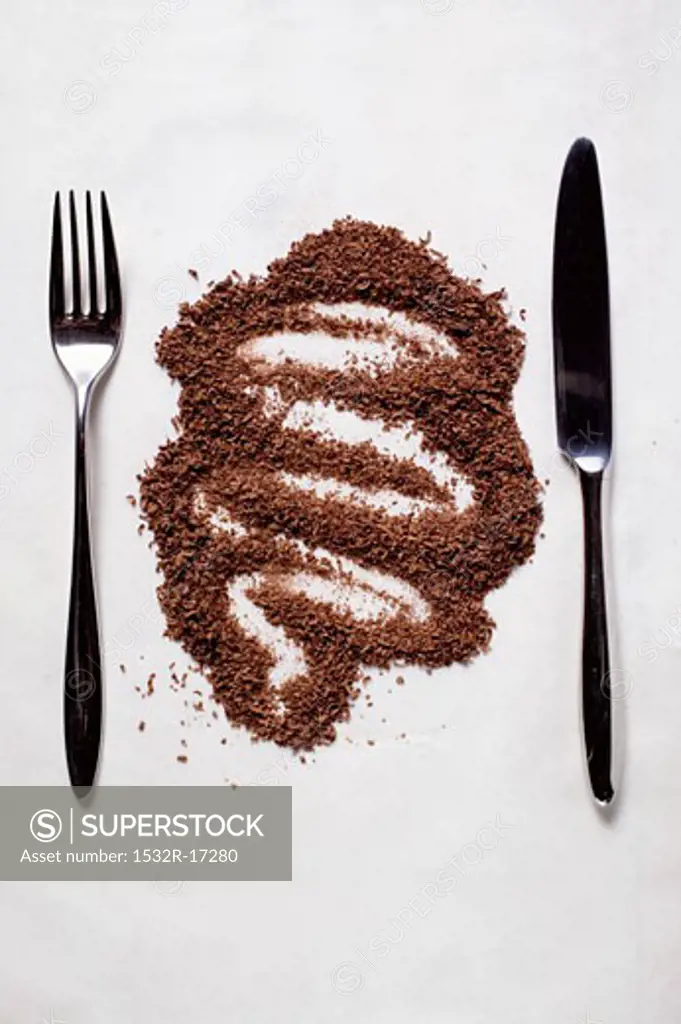 Grated chocolate between knife and fork