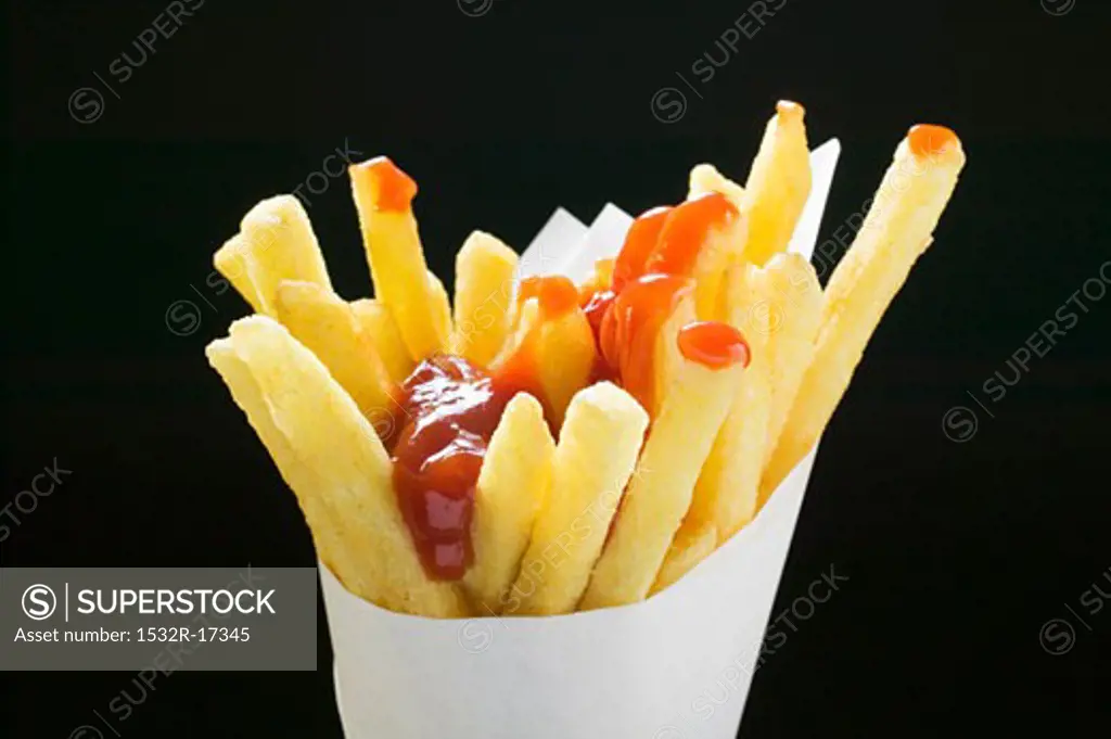 Chips with ketchup in paper cone