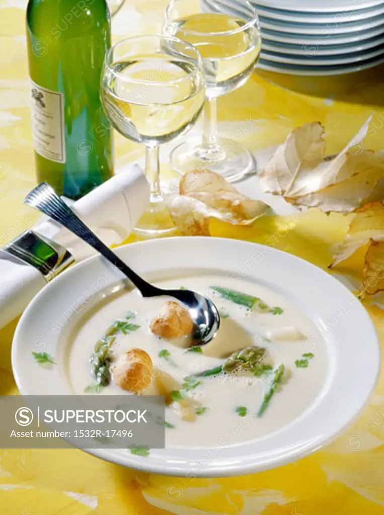 Asparagus soup with savoury choux pastry puffs; white wine