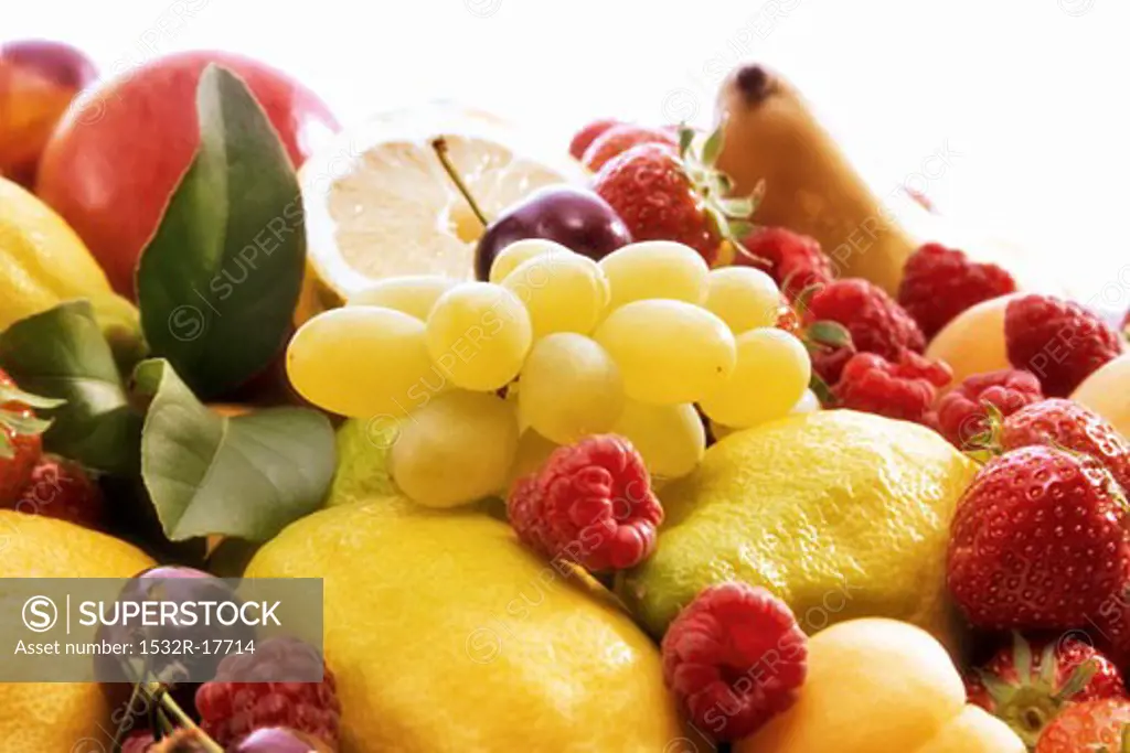 Fruit still life with grapes, berries and lemons