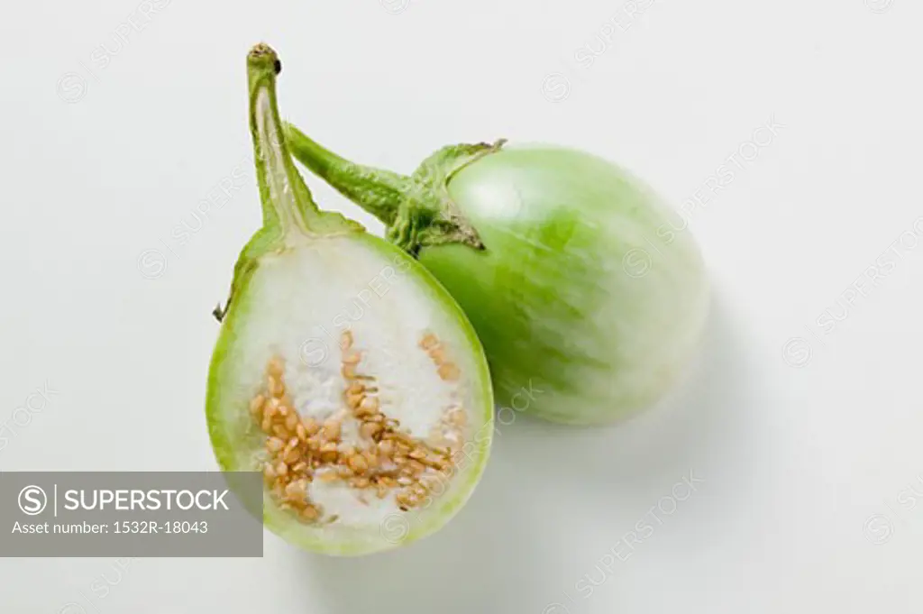 Green baby aubergine, halved