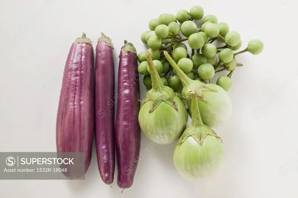 Green and purple baby aubergines