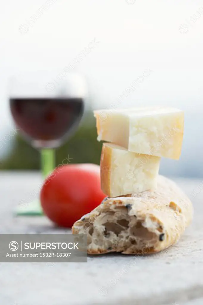 Cheese, bread, tomato and wine