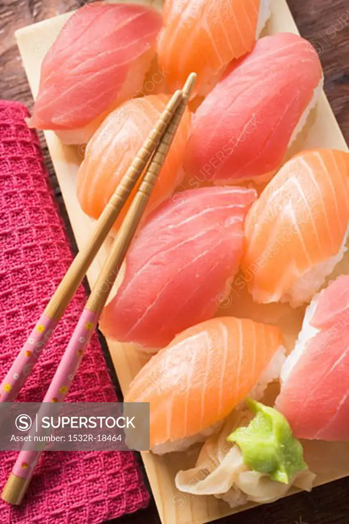 Nigiri sushi with tuna and salmon on sushi board