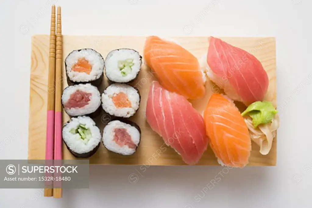 Maki sushi and nigiri sushi on sushi board