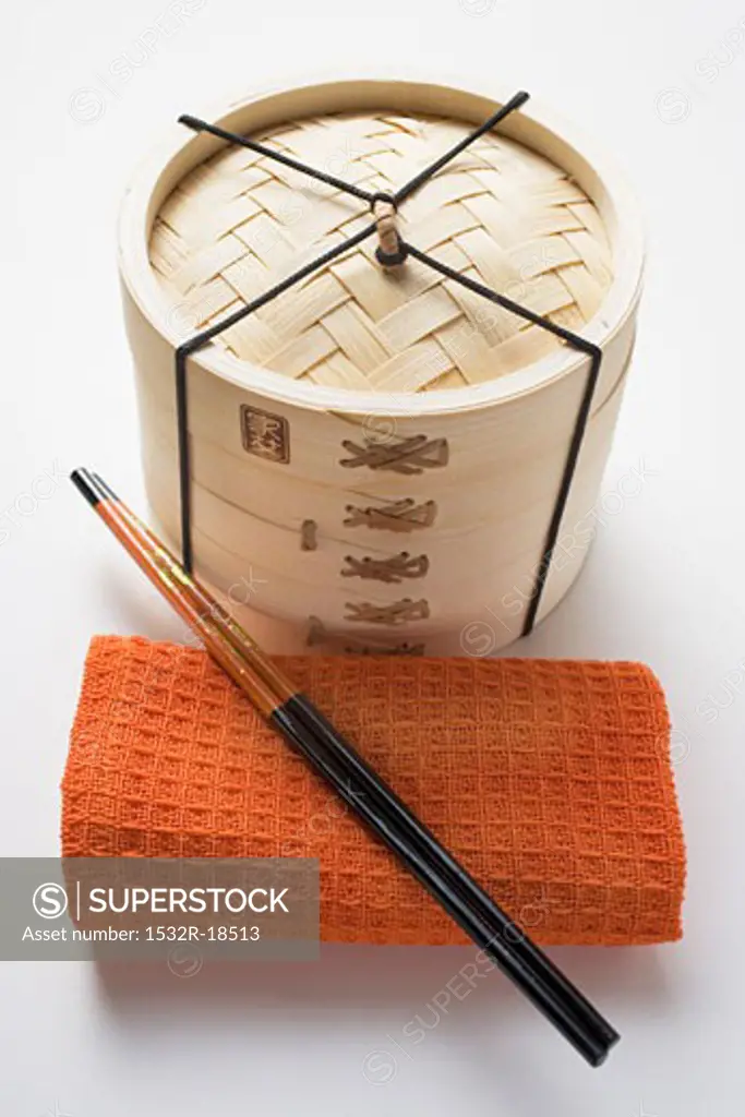 Hand towel, chopsticks and bamboo steamer