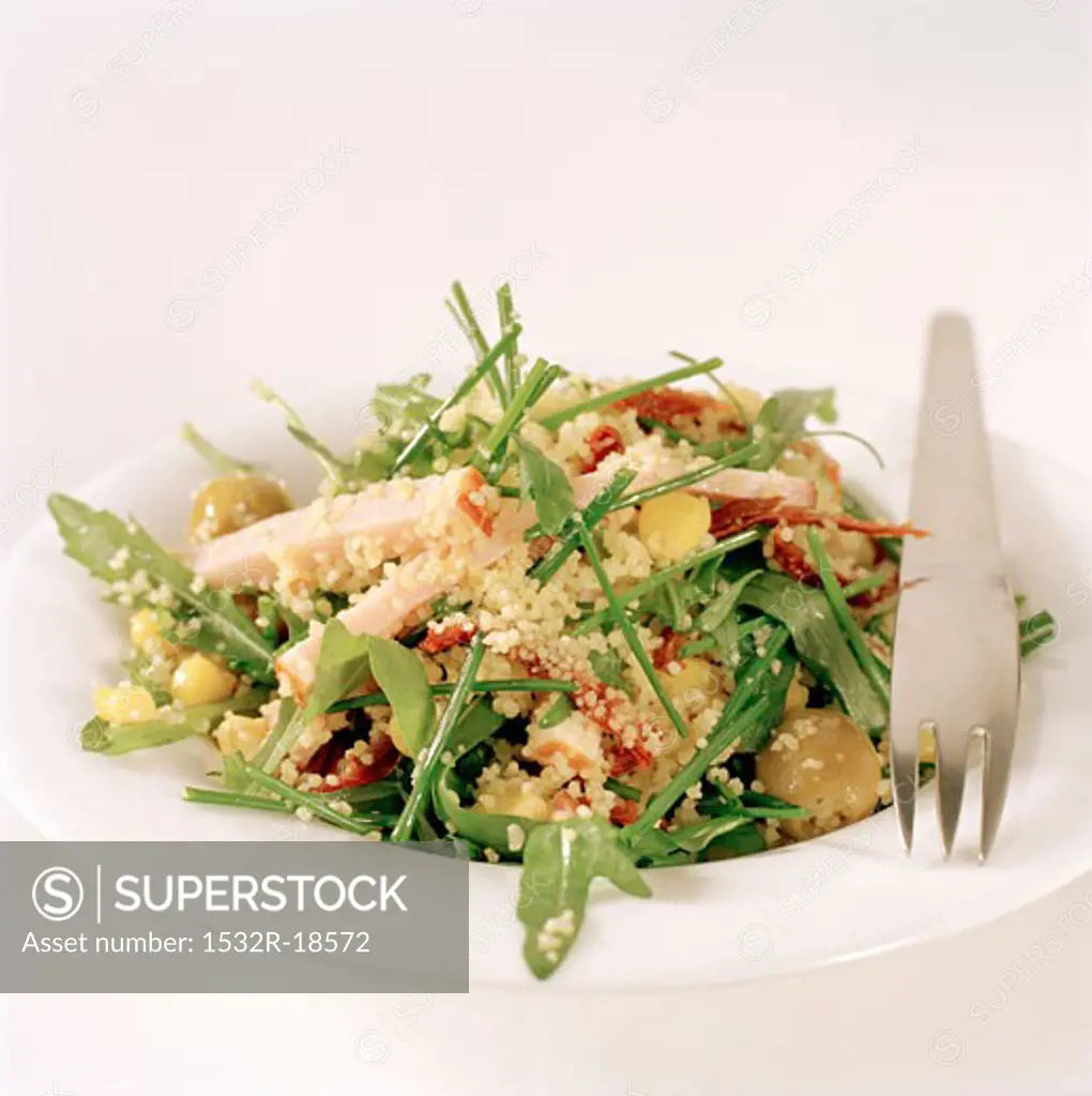 Rocket and couscous salad with strips of turkey