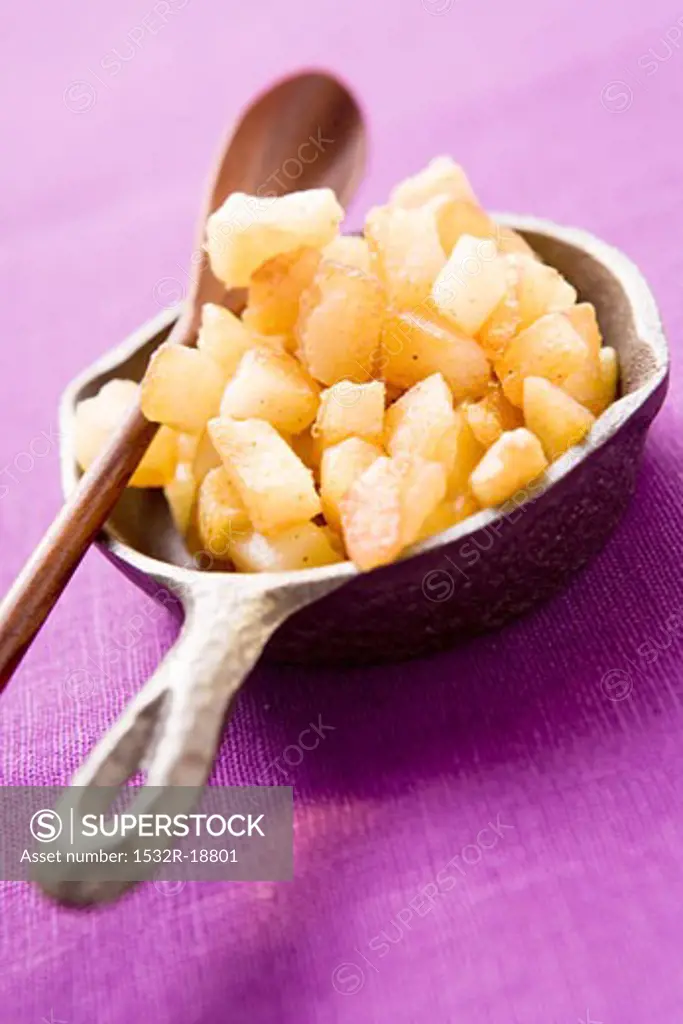 Fried potatoes in a small pan