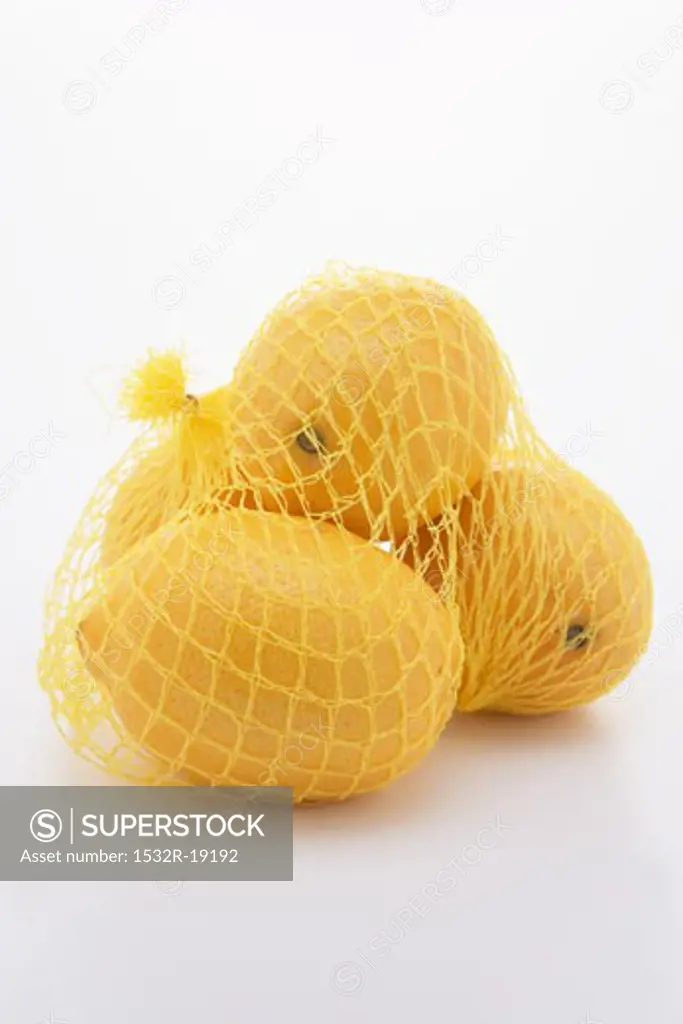 Four lemons in a net