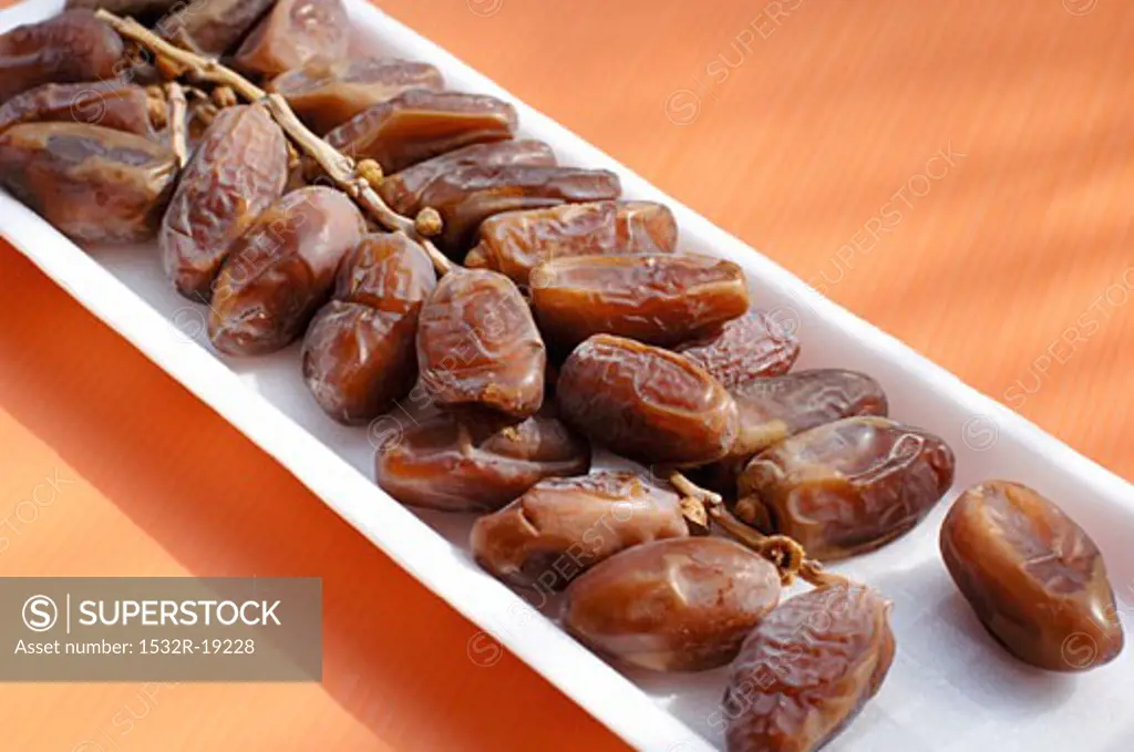 Dried dates in a polystyrene tray