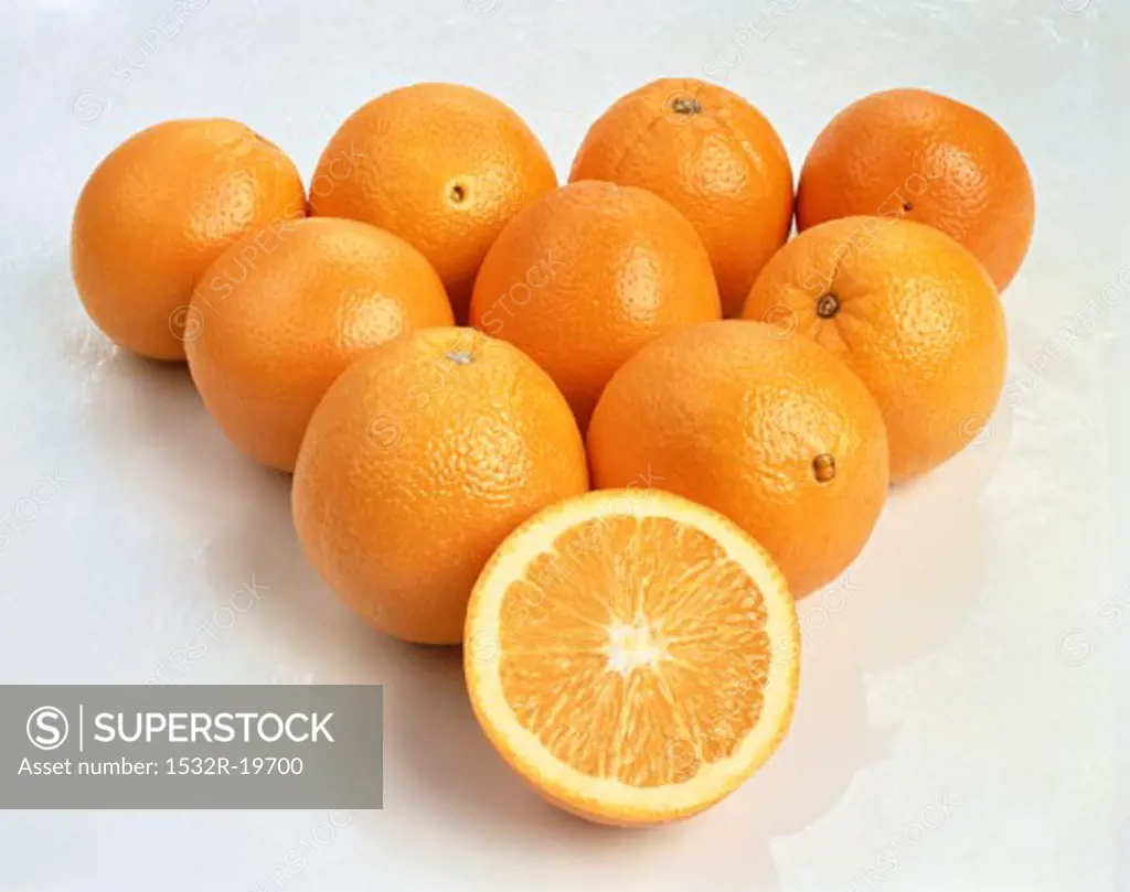 Whole navel oranges and one orange half