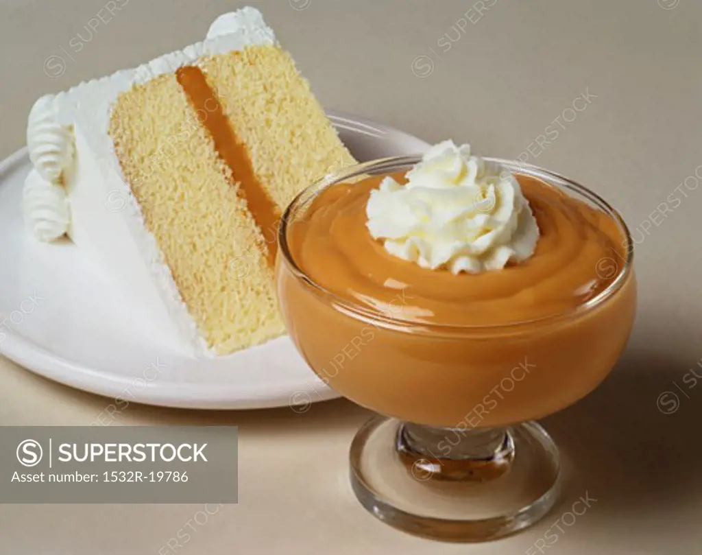 Piece of cake and butterscotch dessert with cream