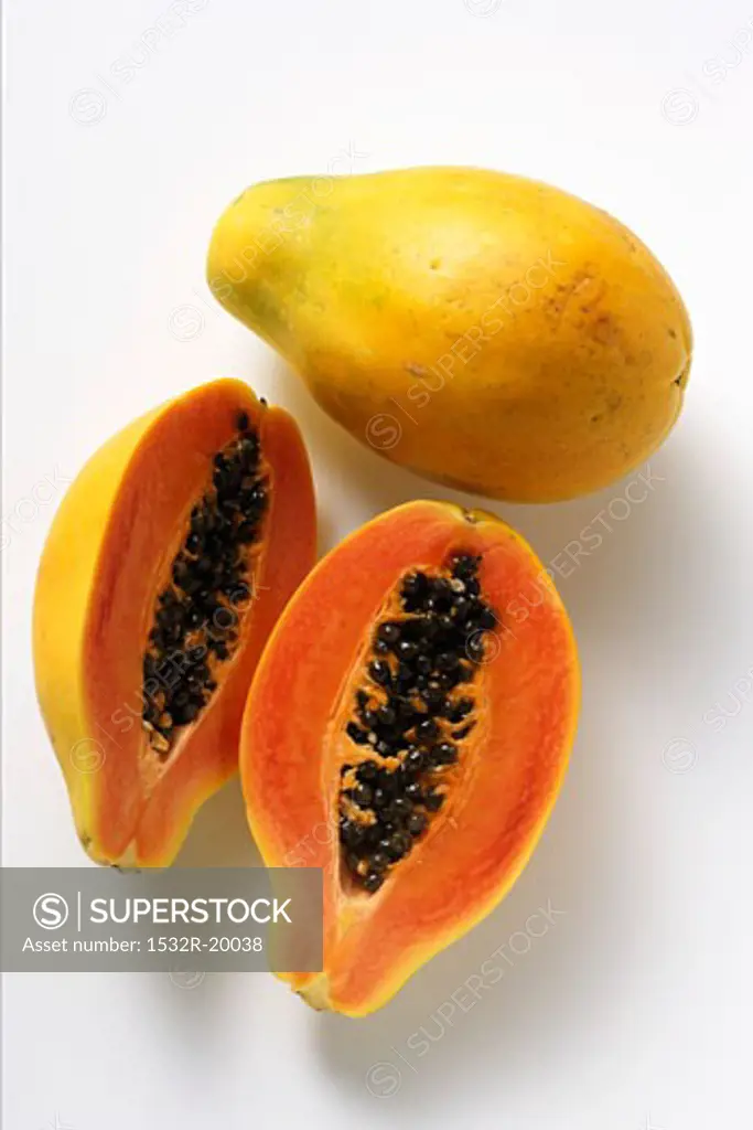 Whole and half papayas