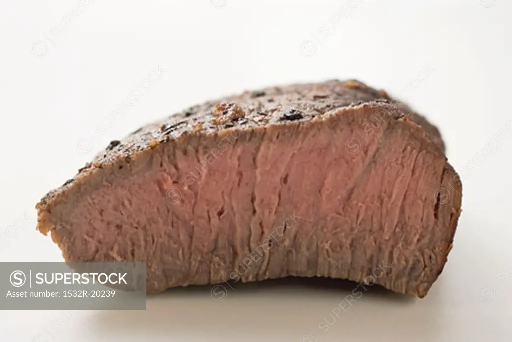 Beef steak with a piece cut off