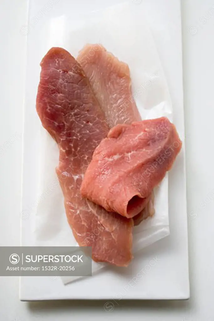 Pork, turkey and veal escalopes on paper