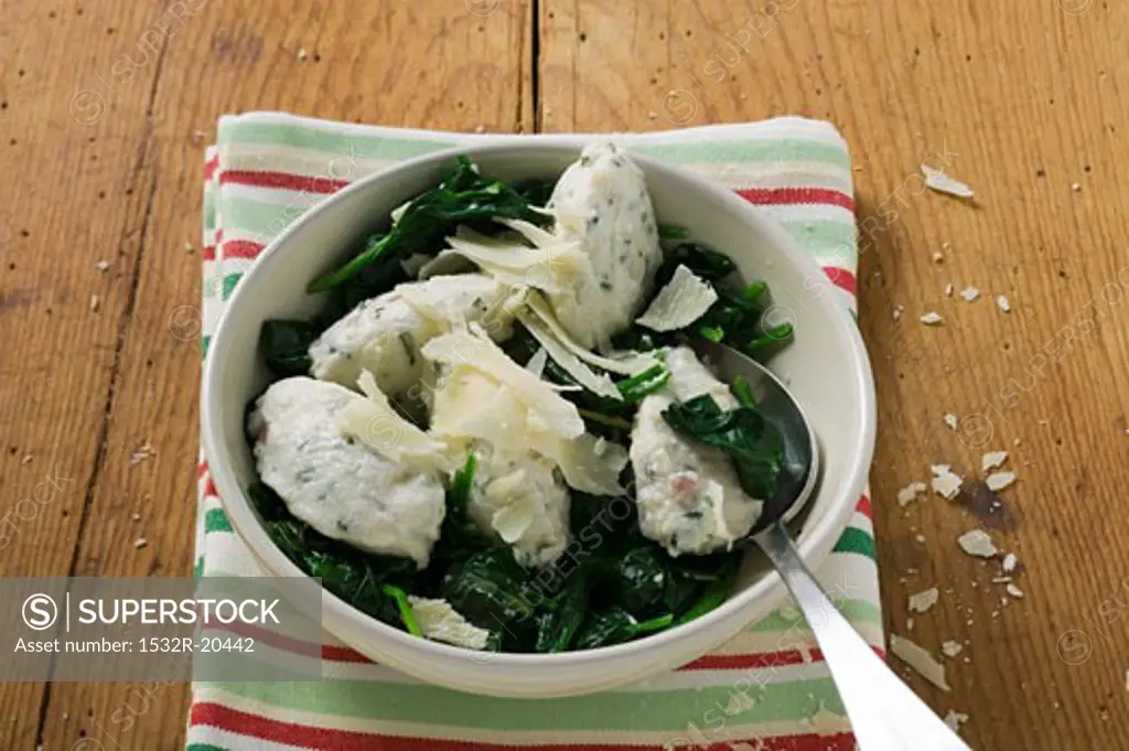 Ricotta and mortadella gnocchi with spinach and Parmesan