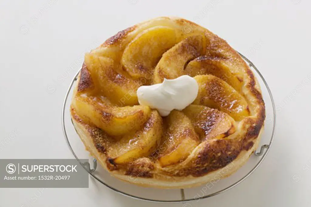 Puff pastry apple tart with blob of cream (Liguria)