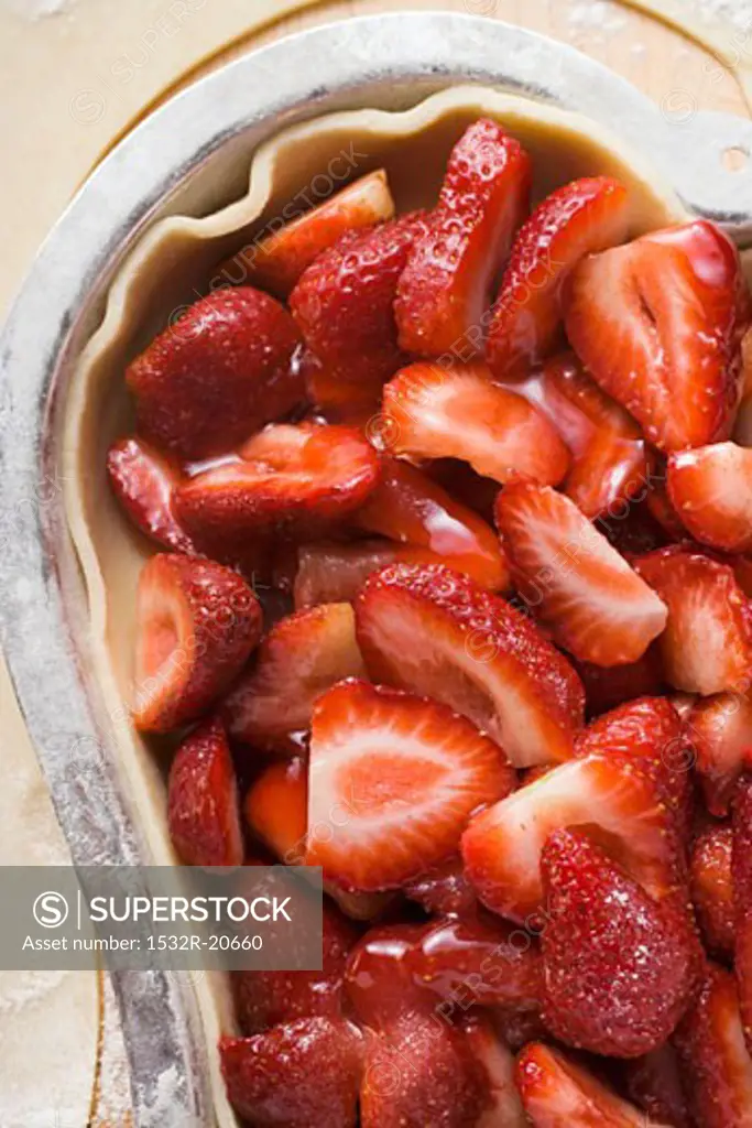 Heart-shaped strawberry pie, unbaked (close-up)