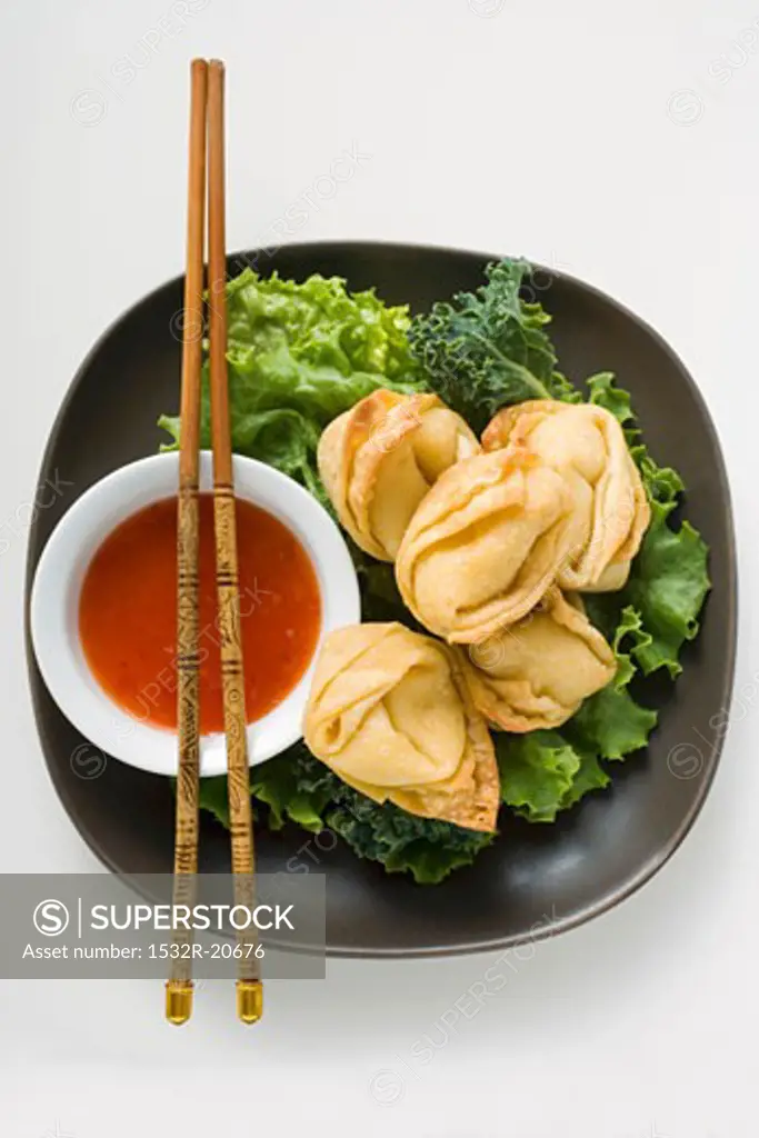 Deep-fried wontons with sweet and sour sauce