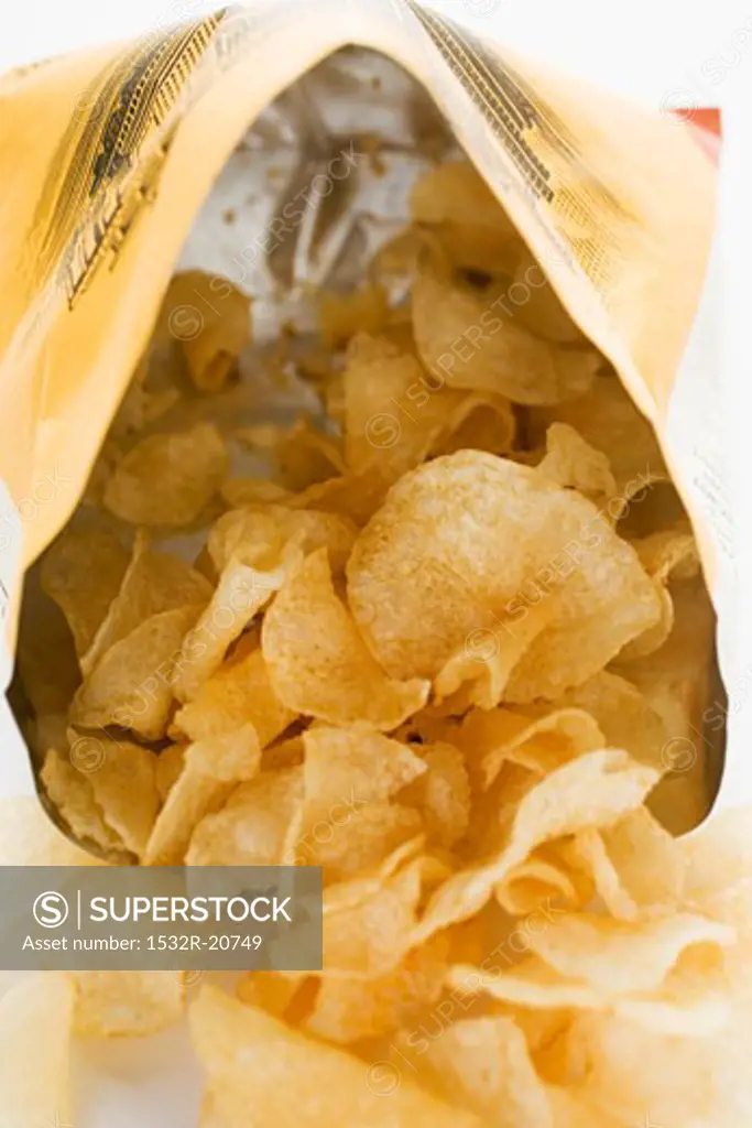Potato crisps in opened bag