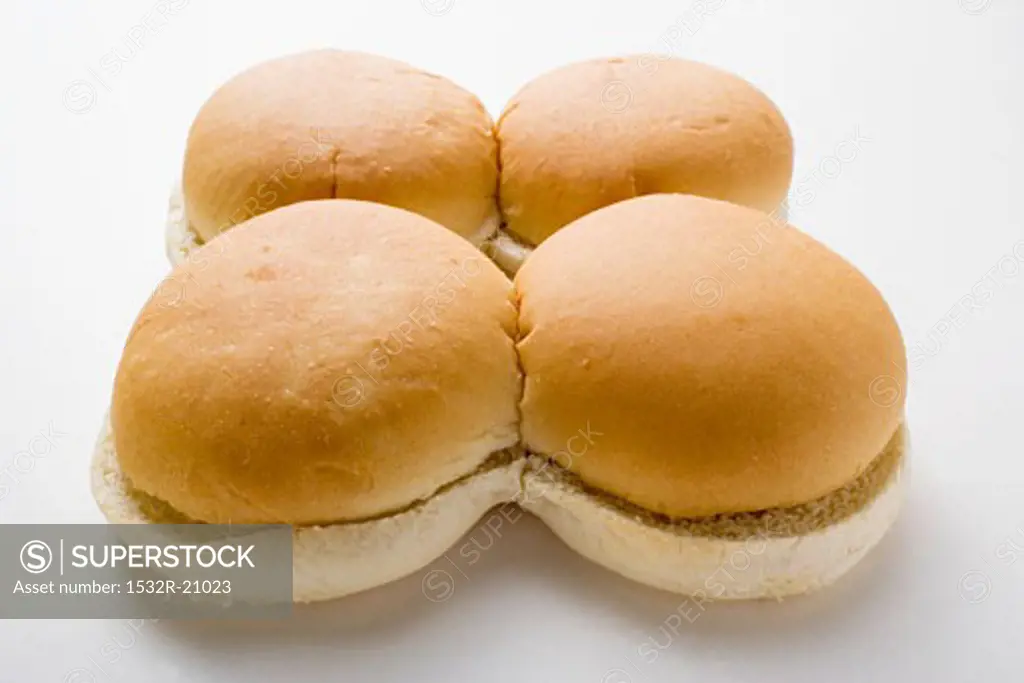 Four hamburger buns, split