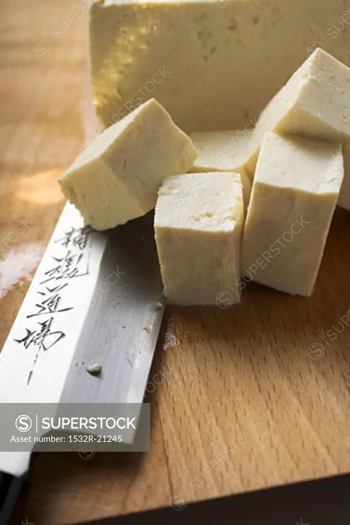 Block of tofu, diced tofu and Asian knife