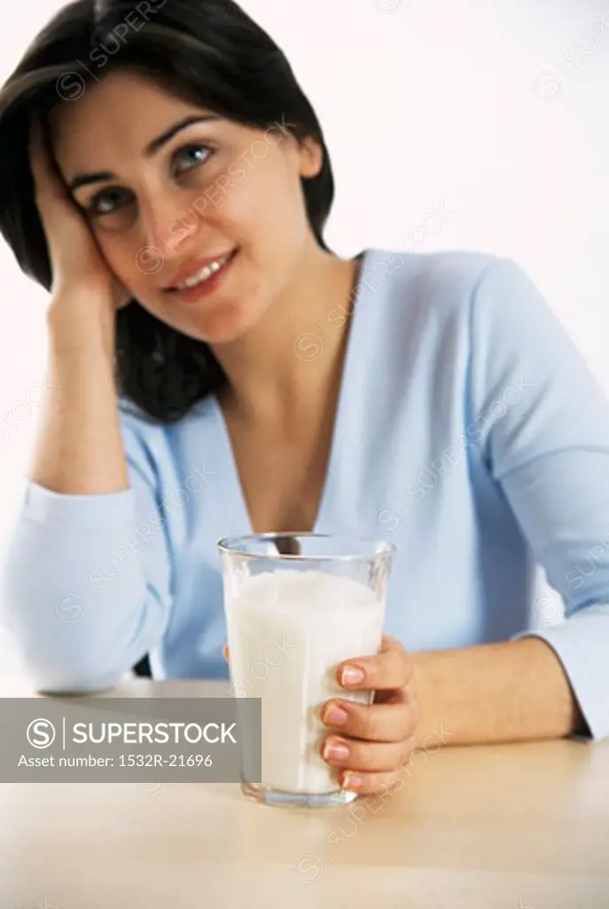 Young woman with a glass of milk