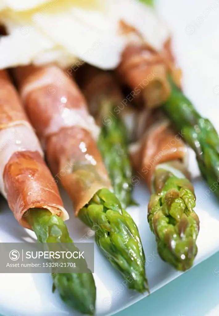 Green asparagus wrapped in ham