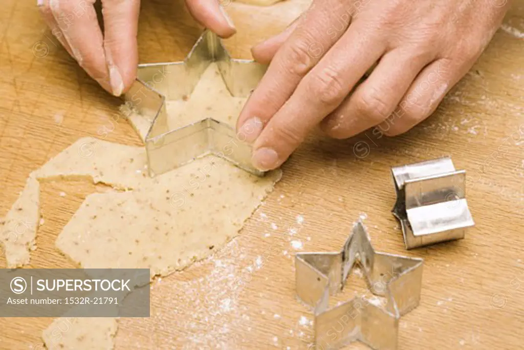 Cutting out star-shaped biscuit