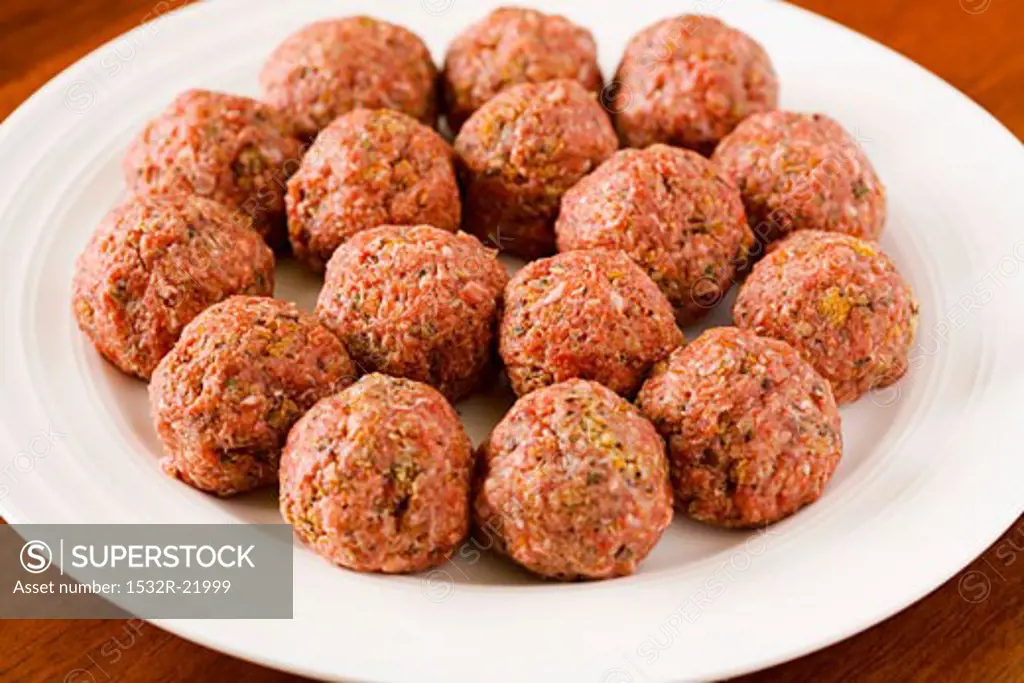 Raw meatballs on a plate