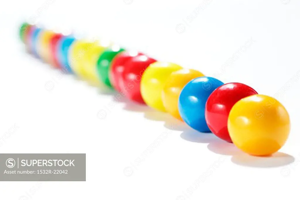 A row of coloured chewing gum balls