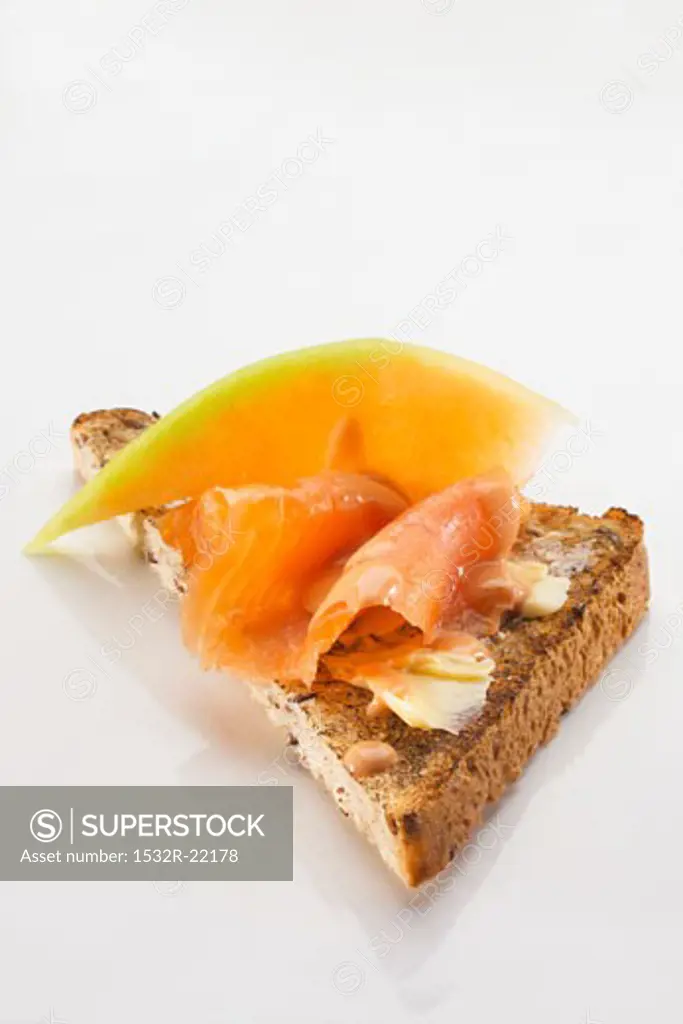 Toast triangle with salmon and melon