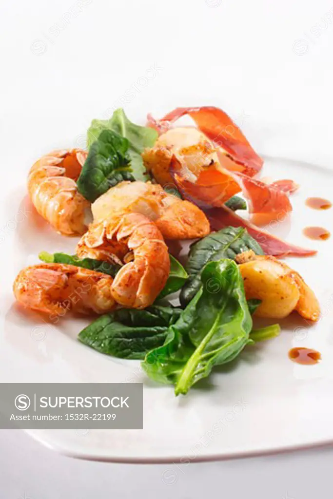 Fried seafood with spinach and bacon