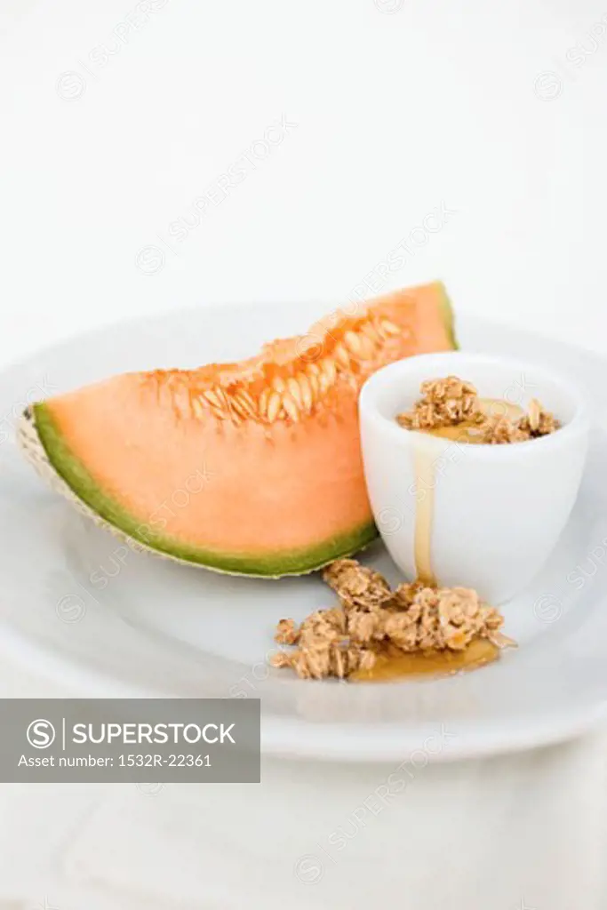 Yoghurt with muesli, honey and melon
