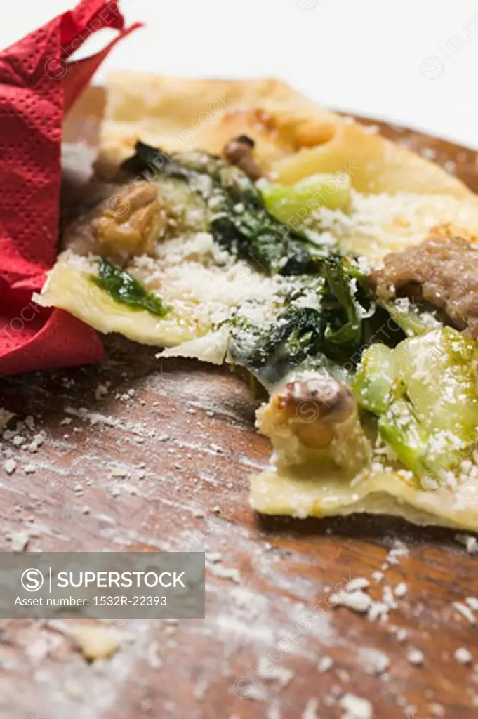Remains of flatbread with mince, chard and Parmesan