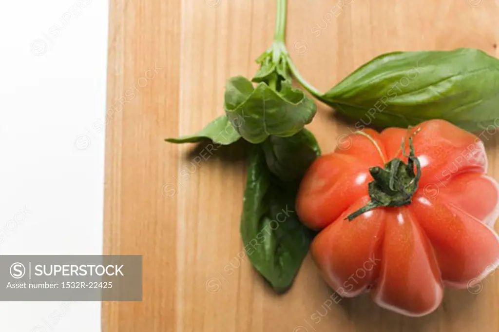 Red beefsteak tomato and basil